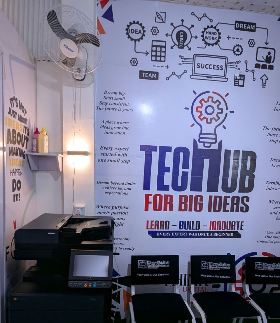 Production printer beside the Tech Hub wall